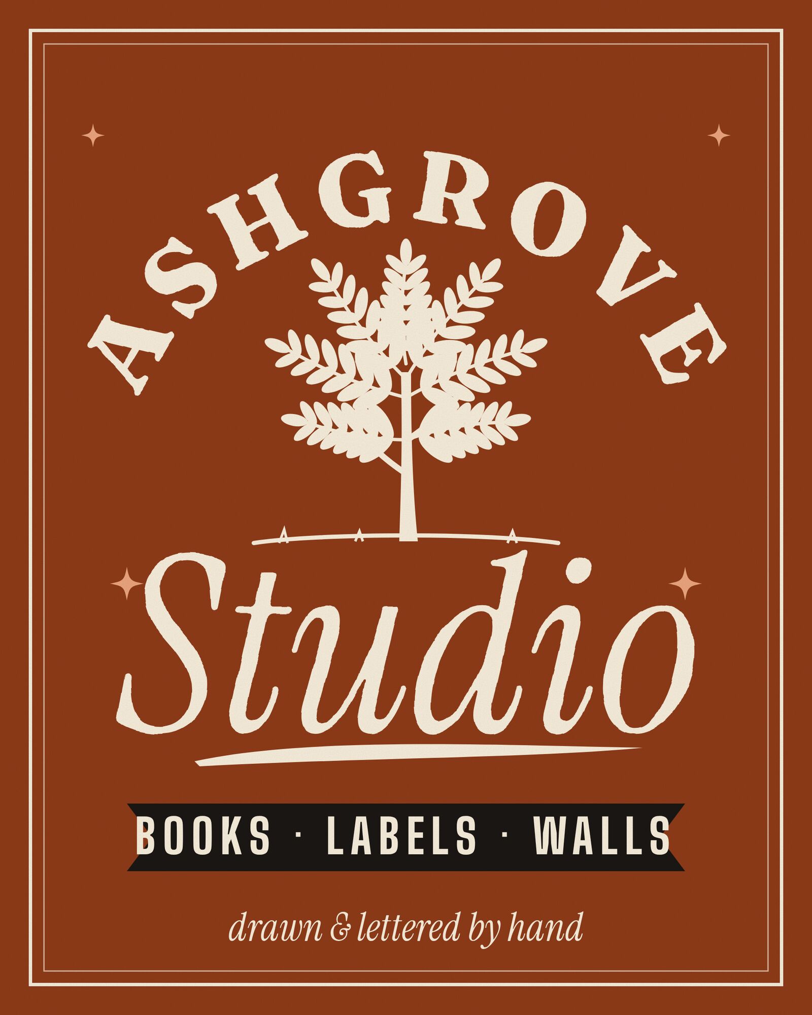 The studio's own lettered mark on rust: ASHGROVE arched over a drawn ash tree, Studio in a cream script, and a black ribbon reading books, labels, walls