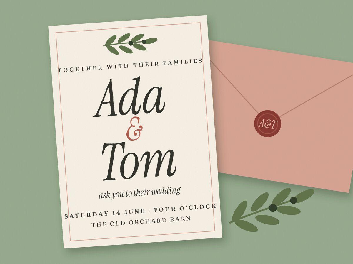 A cream wedding invitation lettered Ada and Tom in a flowing italic, an olive sprig above, lying on sage linen beside a dusty-rose envelope with a wax seal